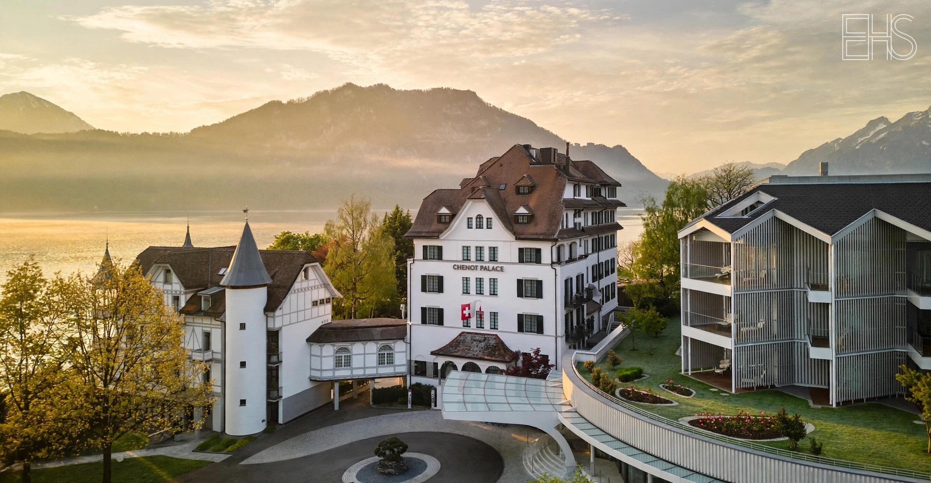Chenot Palace Weggis: The Chenot Method on Lake Lucerne | EverHealthSpan Chenot Palace Weggis: grand palace building on Lake Lucerne with mountains behind, in golden morning light